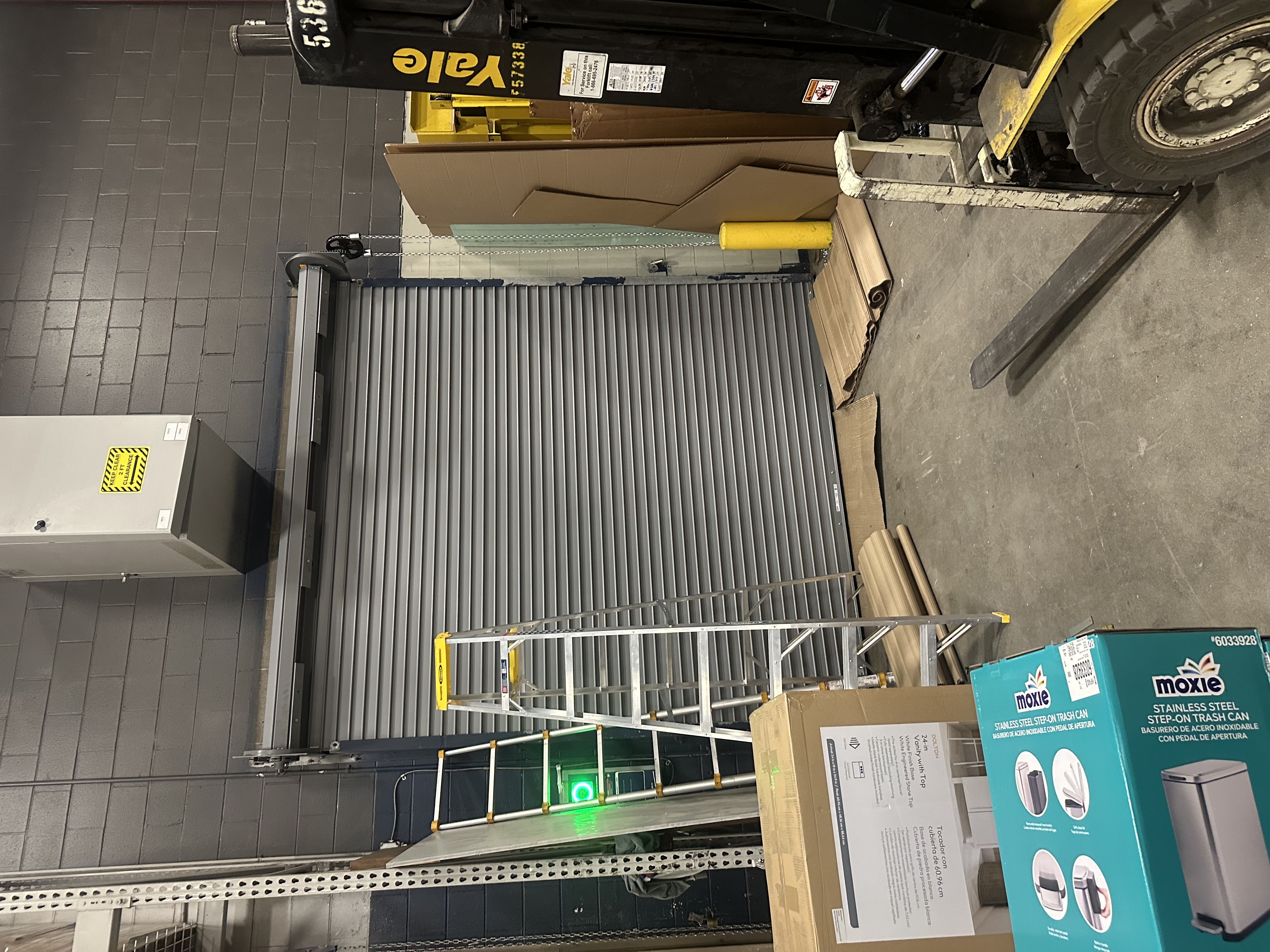 Commercial roll-up door installation in a warehouse